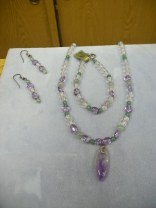 This is a Jade, Amethyst, and Rock crystal frosted bead necklace with a freeform Amethyst drop.  There are matching drop pierced earrings and bracelet completing this set.  So bright and cheerful and can be worn with just about anything. Everything is in Sterling Silver.