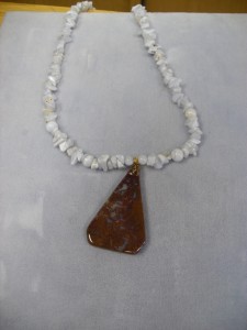 1251-  These are Blue Lace chip beads with a fancy shape drop center brown with blue lace in it.  Fun necklace that goes with everything.