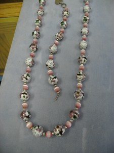 1255- Large 12mm round Cloisonné white/pink beads with pink catseye and sterling silver beads with an engravable heart.  It is 36” long and has a matching engravable bracelet.